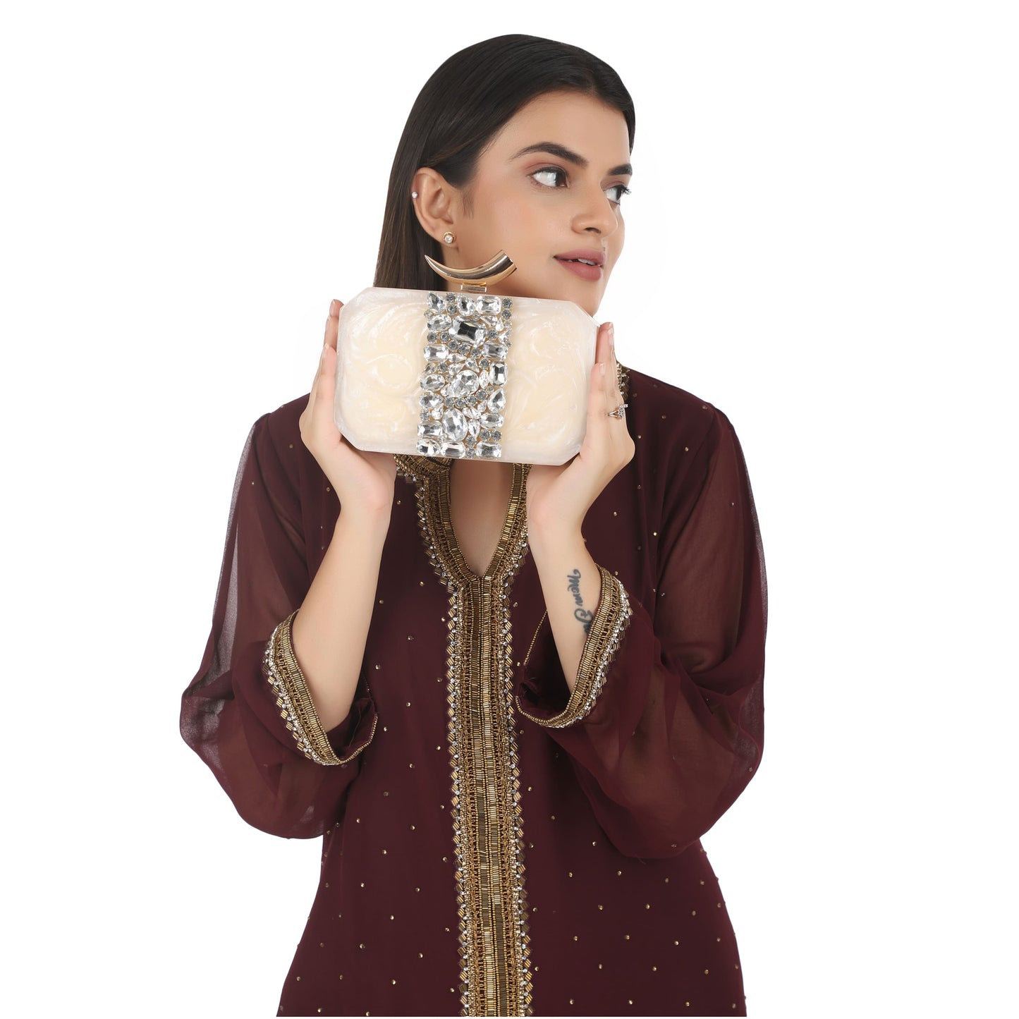 THIS CLUTCH FEATURING HEAVY STONE EMBELLISHMENTS, SOFT ELASTIC LINING, AND AN EXTRA POCKET FOR PRACTICAL STORAGE.