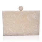 Beautifully crafted salmon resin clutch with exquisite details, perfect for showcasing your style.
